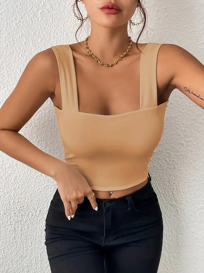 Sleeveless vest with wide shoulders and straps